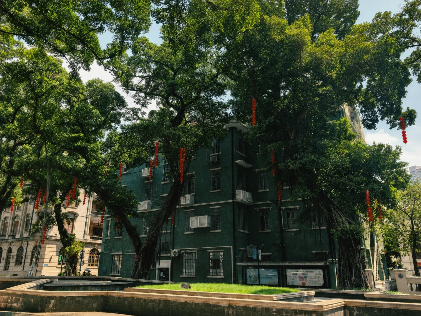 Tree-lined avenue with colonial architecture on Shamian Island