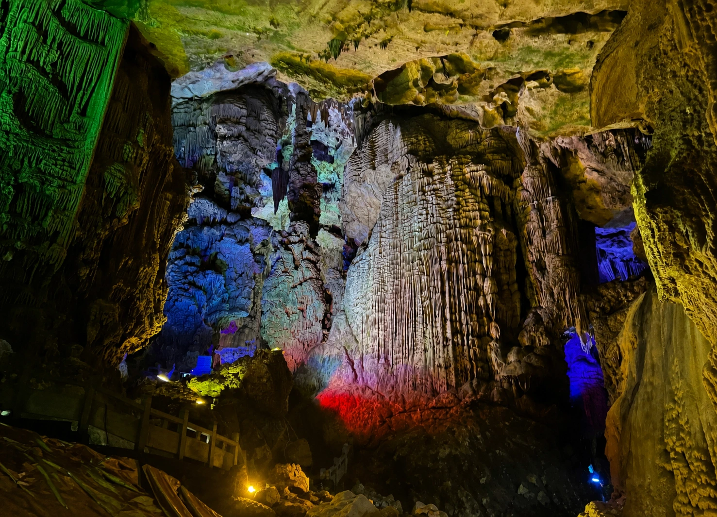 Colorfully lit cave formations showcasing red and blue lighting effects