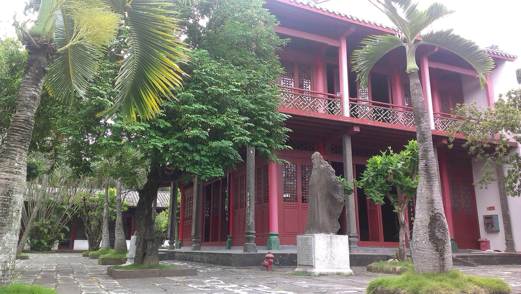 Garden courtyard and red timber galleries at the Five Lords complex