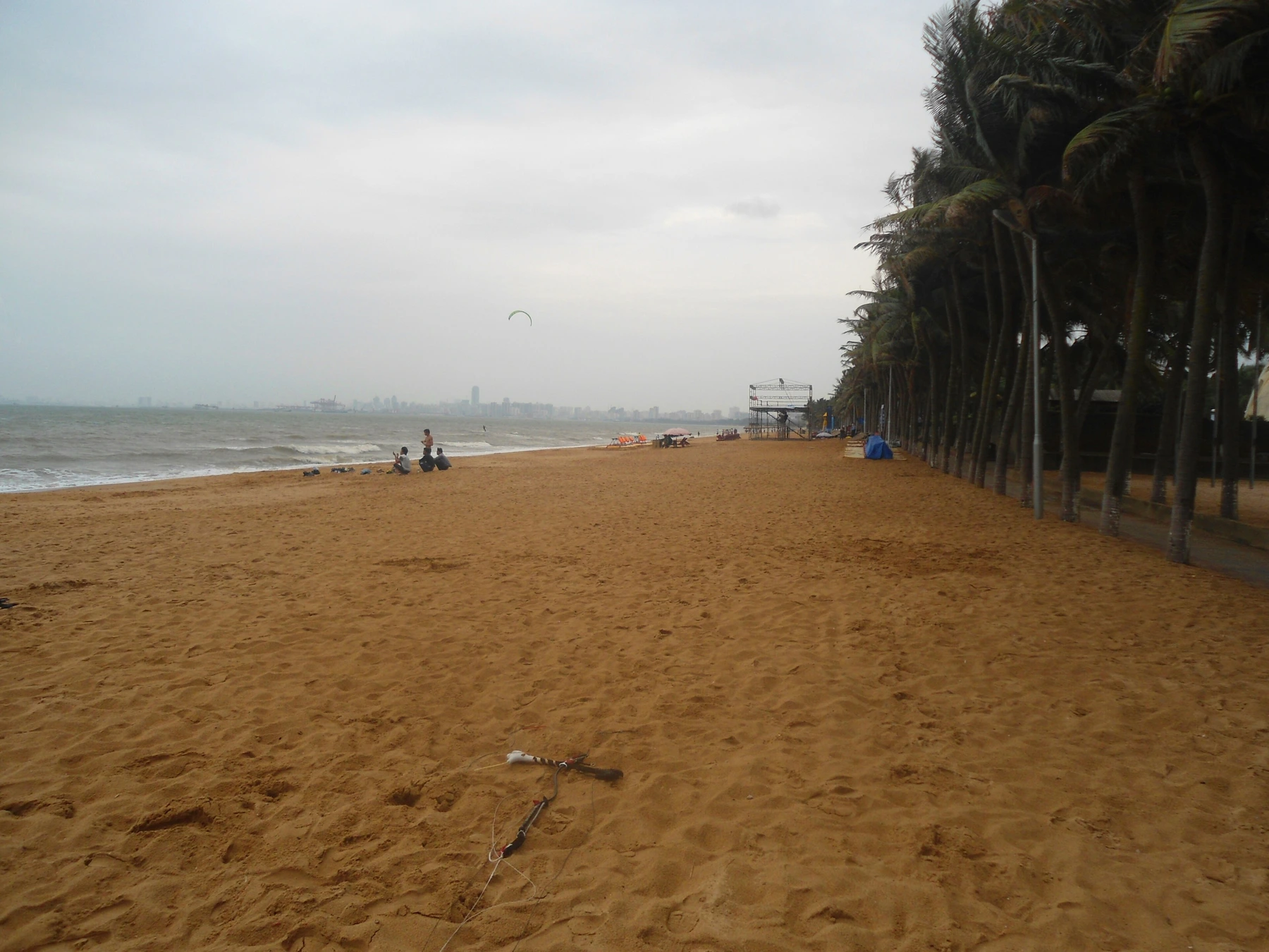 Coconut-lined sandy shore at Holiday Beach looking east