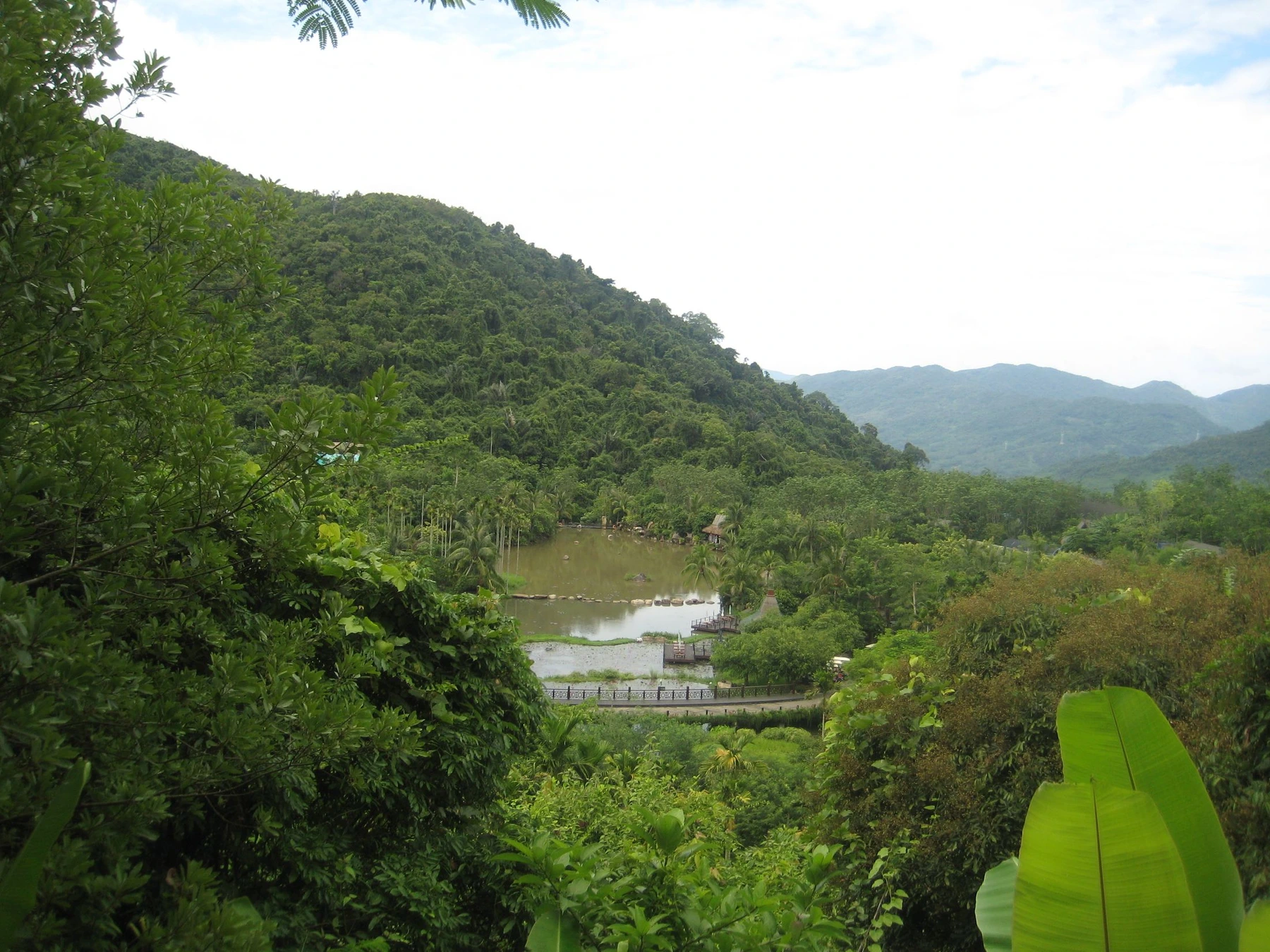 Green hills and water inside the Yanoda rainforest landscape