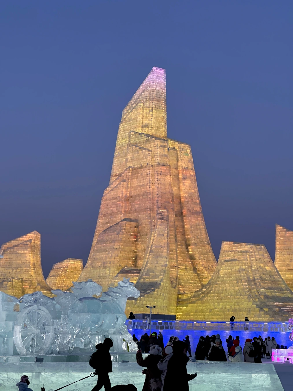 Illuminated monumental ice structure at Harbin Ice and Snow World