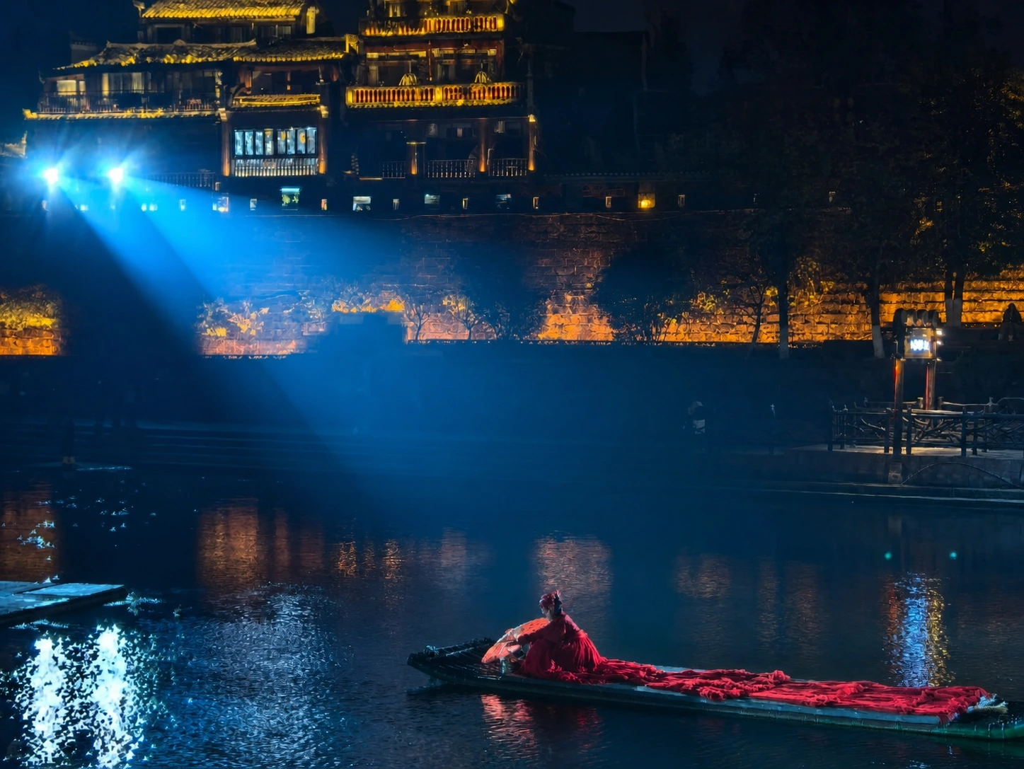 Traditional performance on a boat in Fenghuang Ancient Town at night