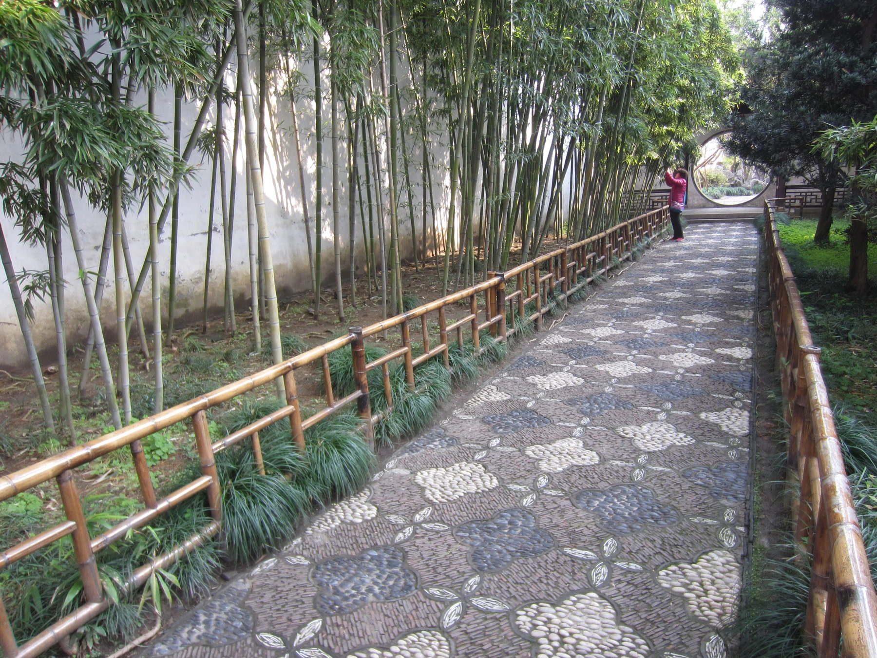 Bamboo-lined path and framed corridor in Lingering Garden