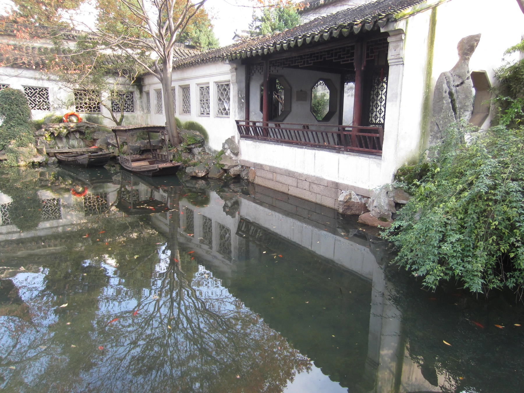 Rockery, water and white-walled architecture inside Lingering Garden