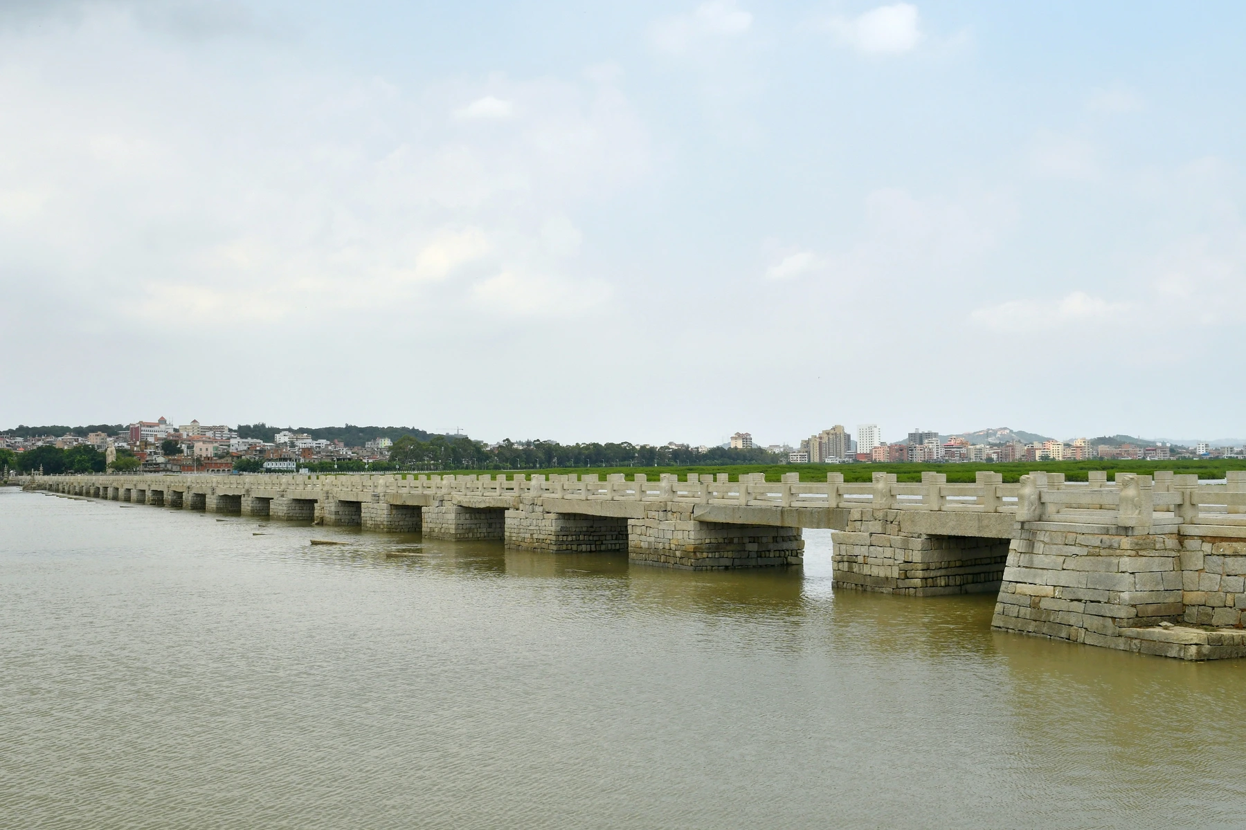 Stone deck and piers of Luoyang Bridge across the tidal estuary