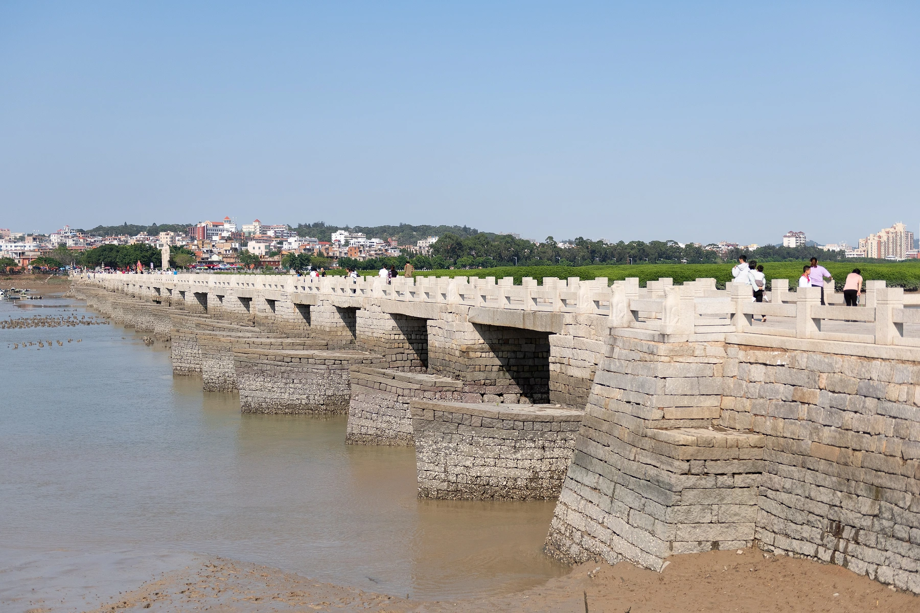 Low stone piers and tidal water beside Luoyang Bridge