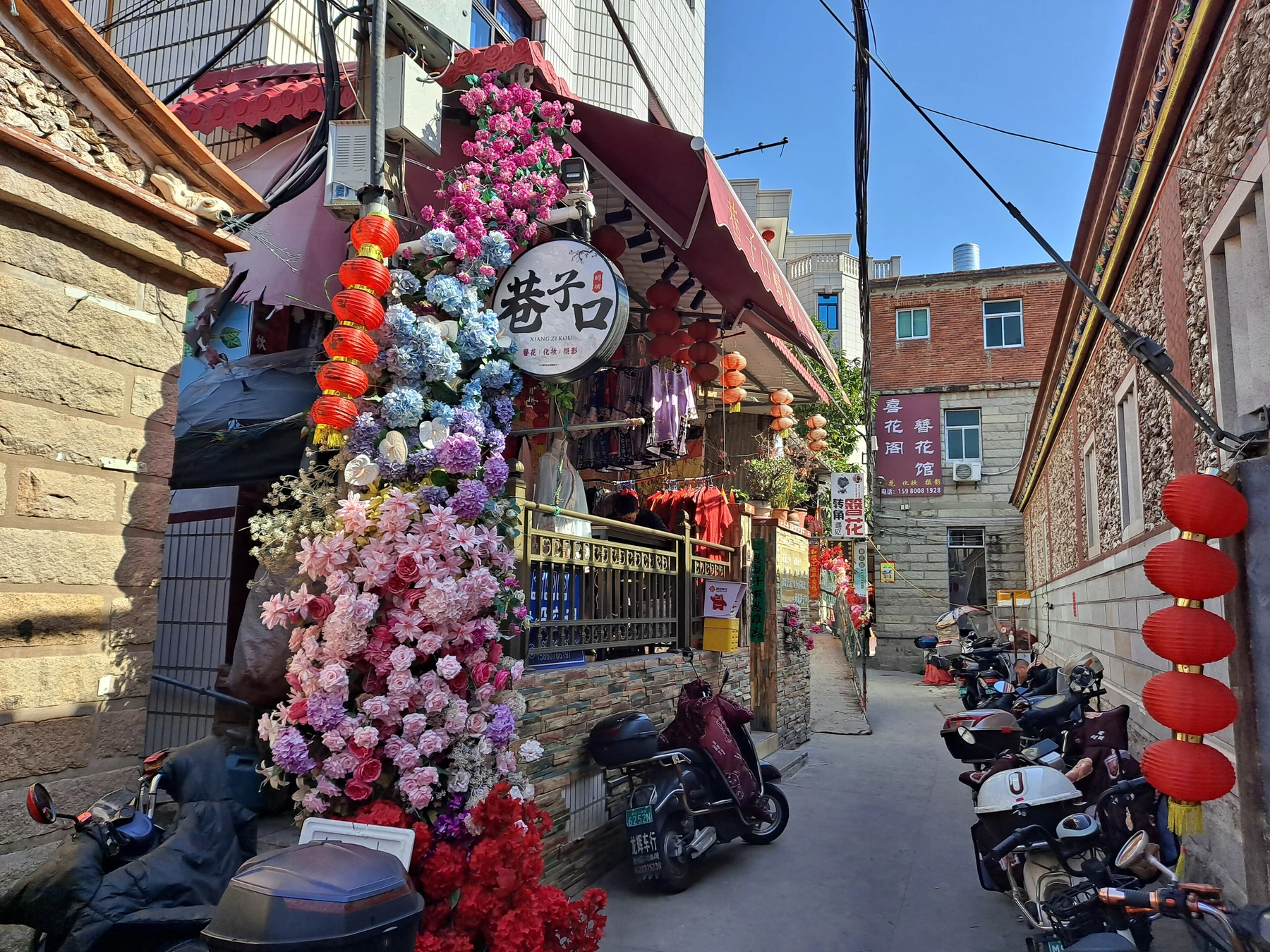 Narrow lived-in lane through Xunpu Village
