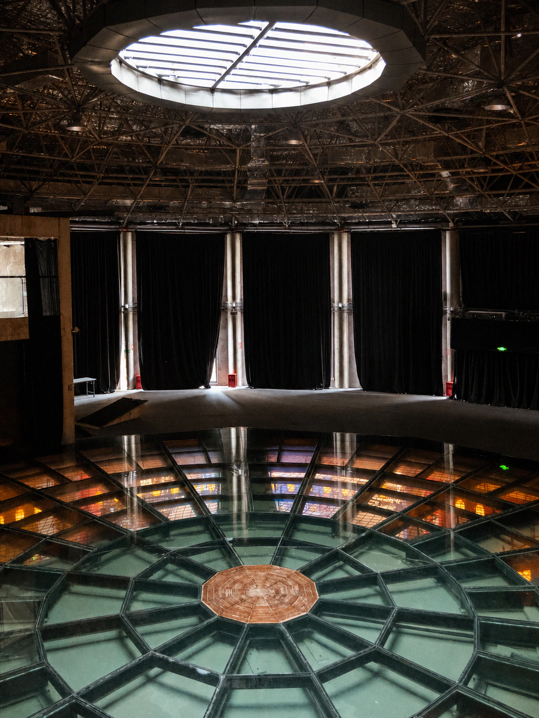 Circular skylight, trusses, and glass floor in the Air Stage at 1933 Old Millfun