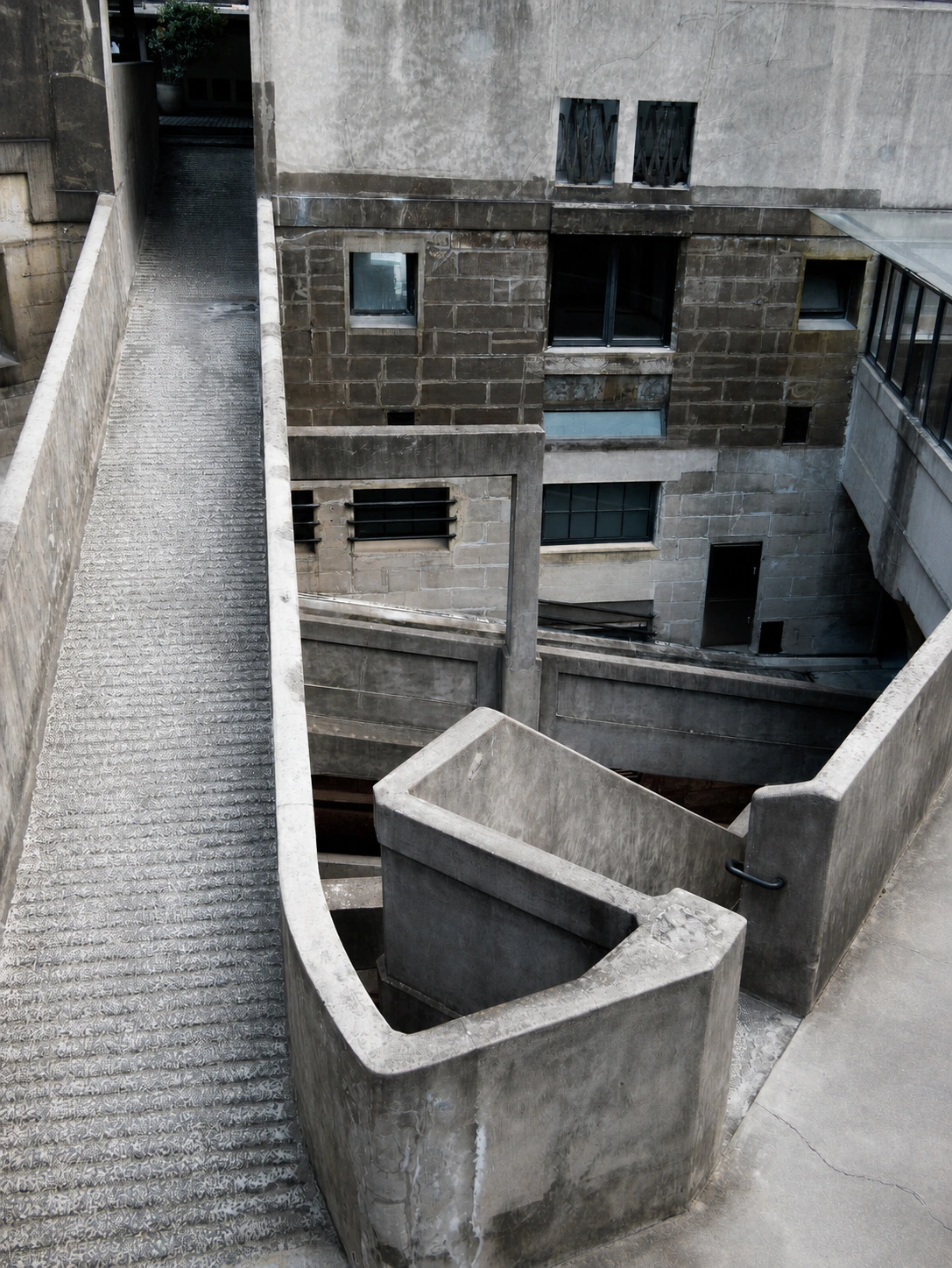 Layered concrete ramps and bridges inside 1933 Old Millfun in Shanghai