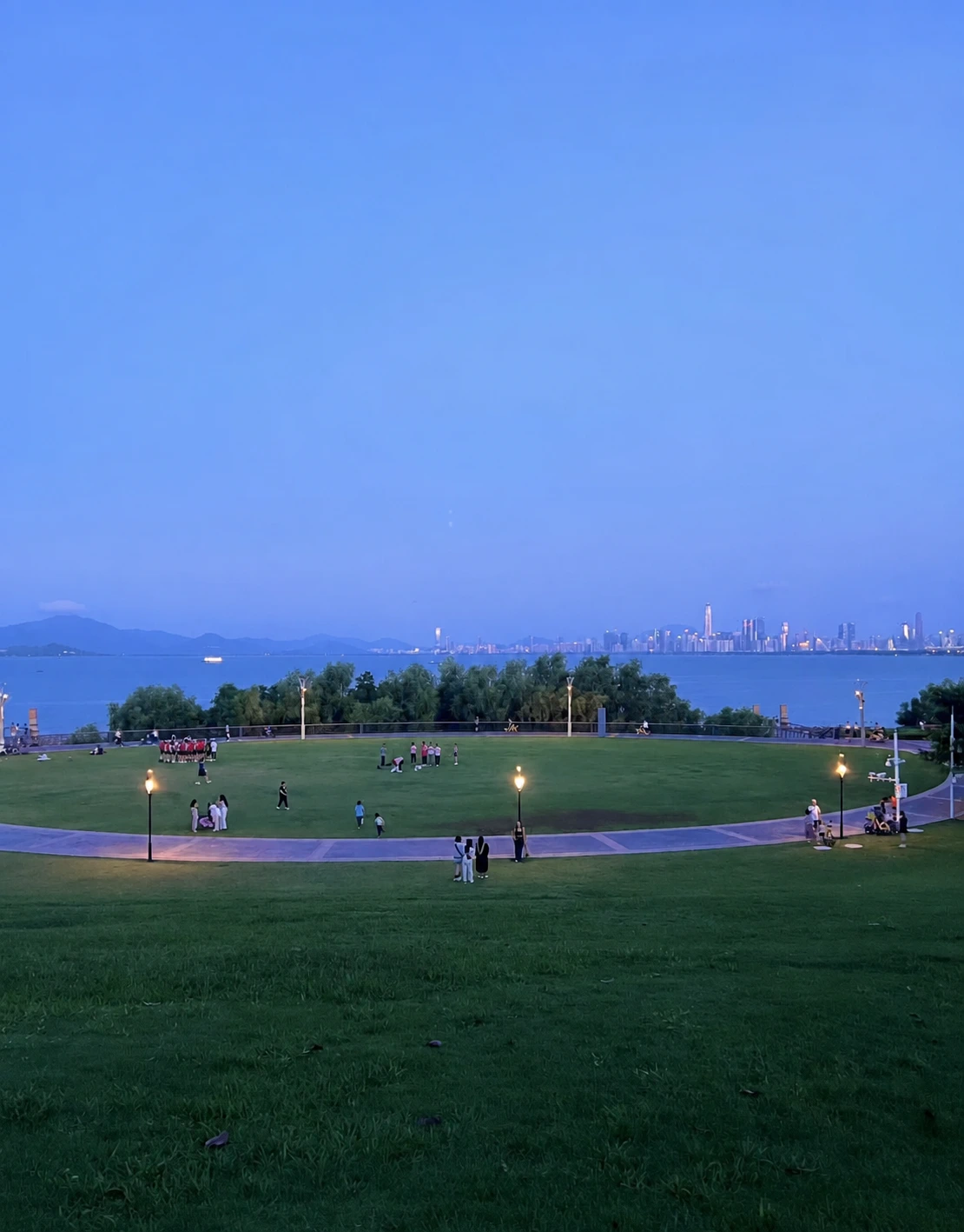 Shenzhen Bay Park at night with illuminated lawn and waterfront