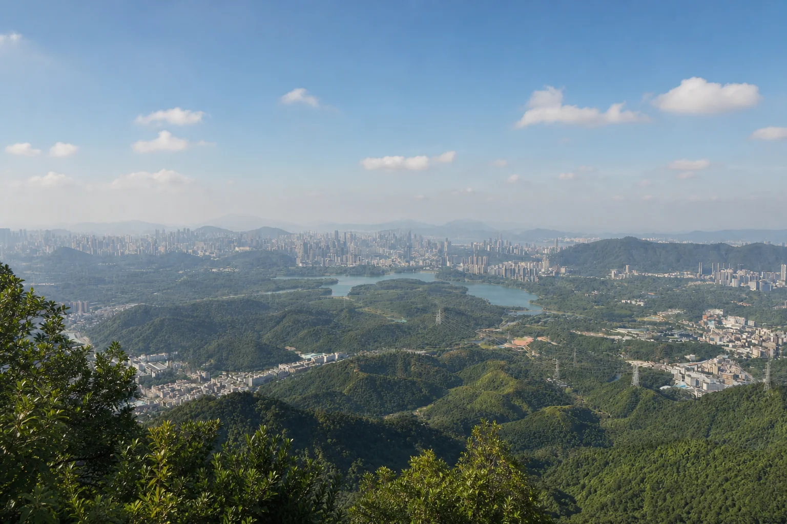 Forested Yangtai ridges, reservoir and Shenzhen's outer-district skyline