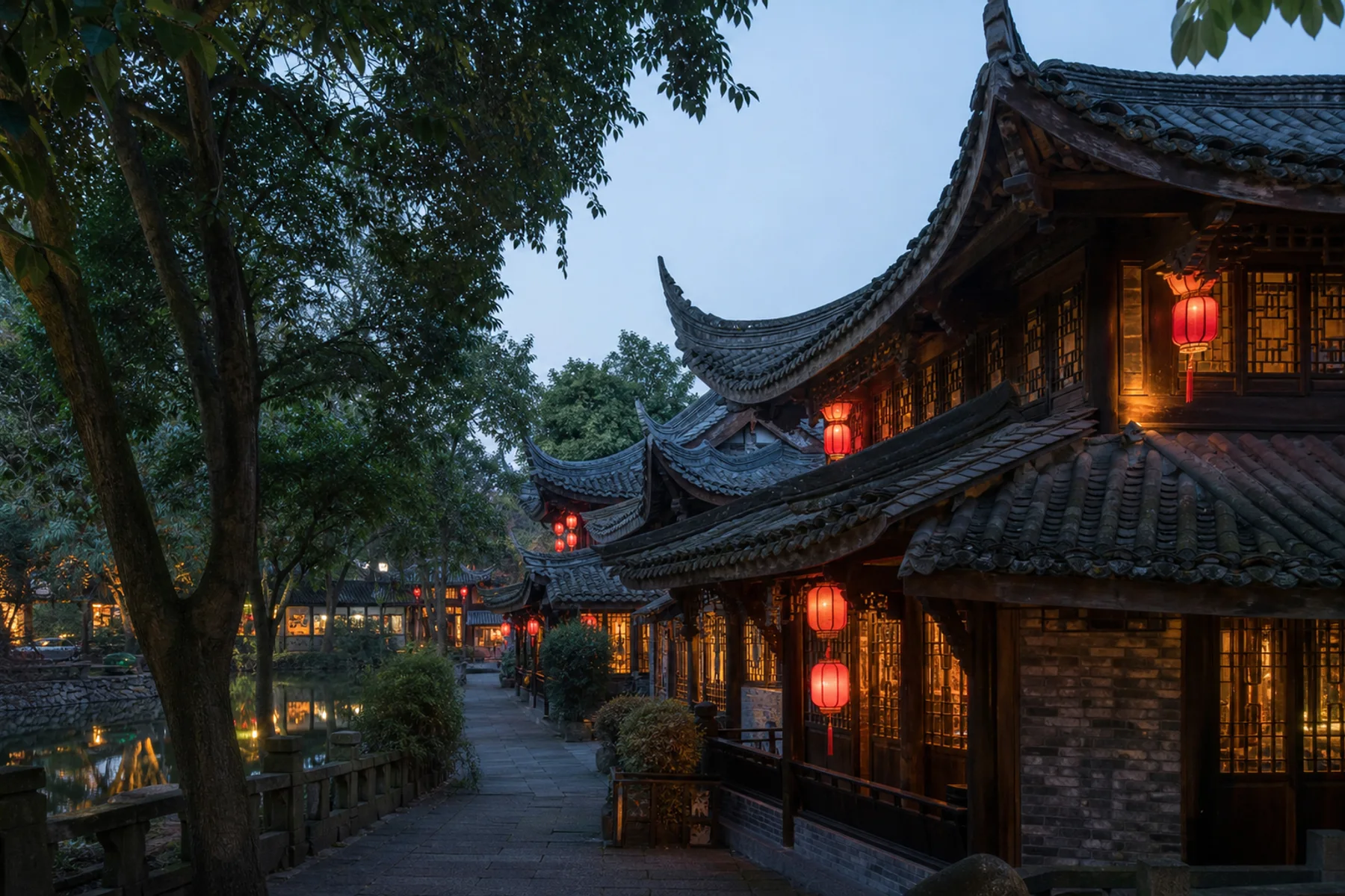 View of reconstructed western Sichuan architecture beside water at Jinli