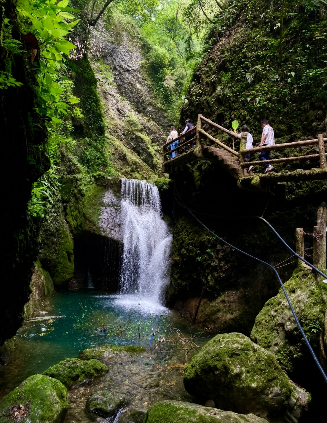 Mountain hiking trail with waterfall views