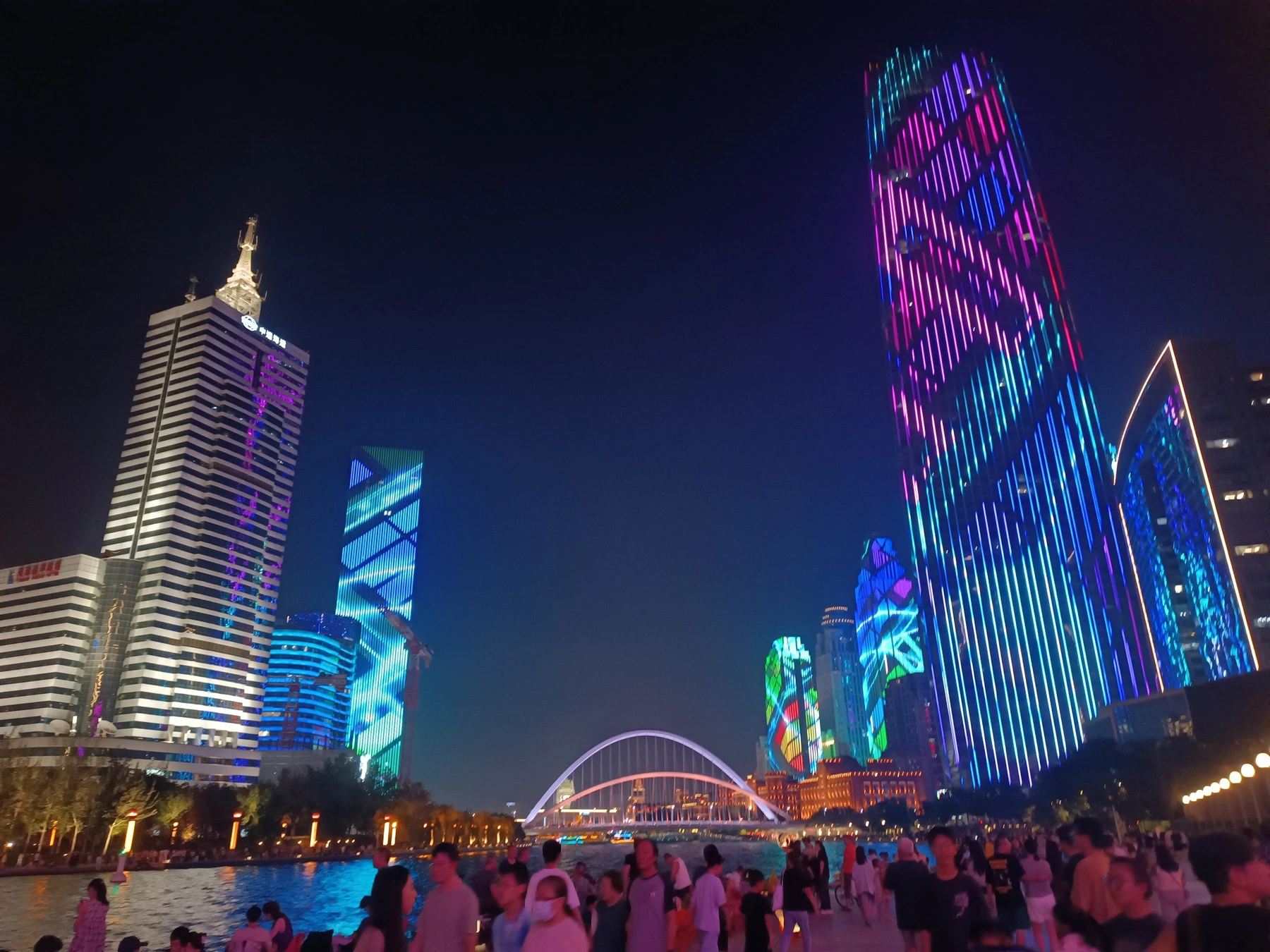 Illuminated buildings and bridges along the Haihe River in Tianjin
