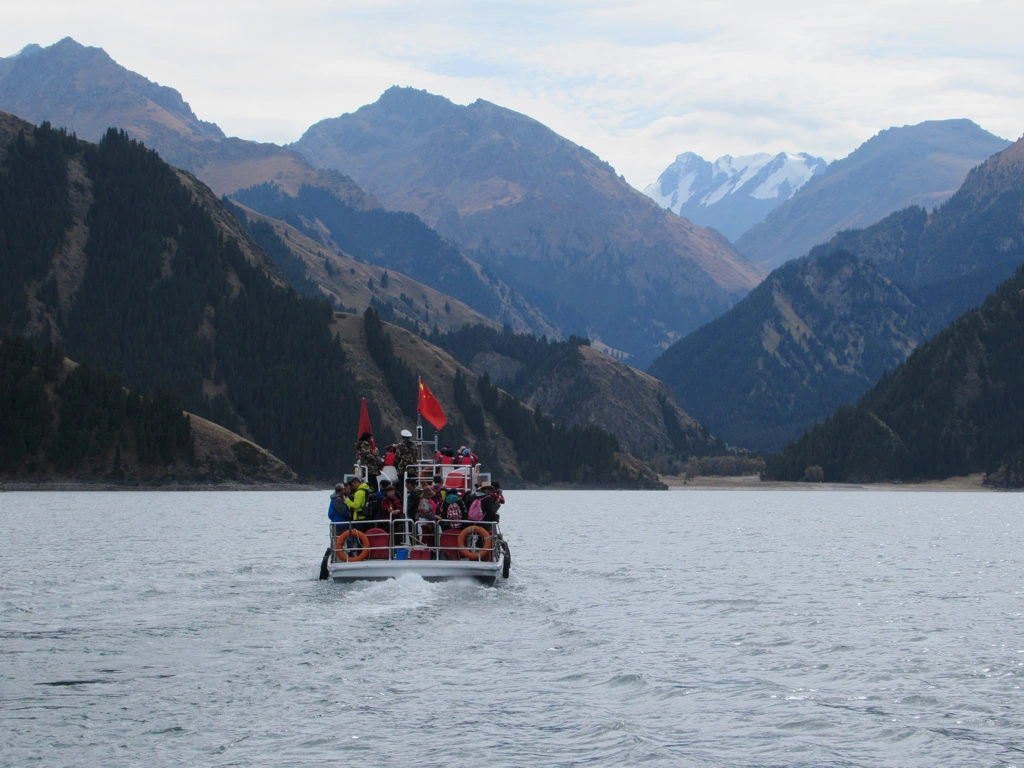 Mountain lake and steep slopes in the Heavenly Lake scenic area