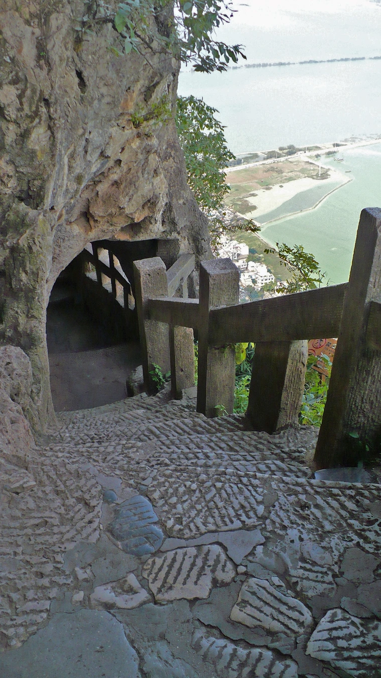 Steep stone steps descending through the Western Hills route