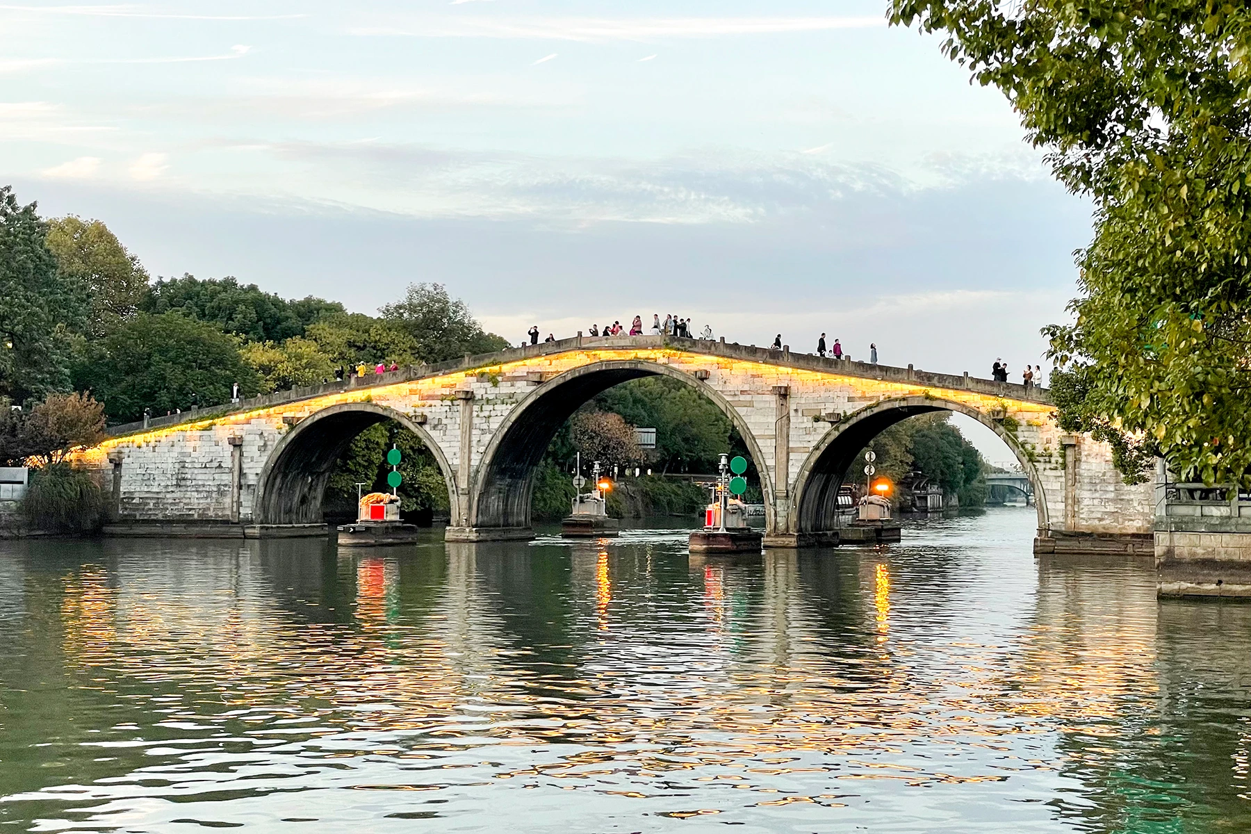 Gongchen Bridge and canal banks at blue-hour light in Hangzhou