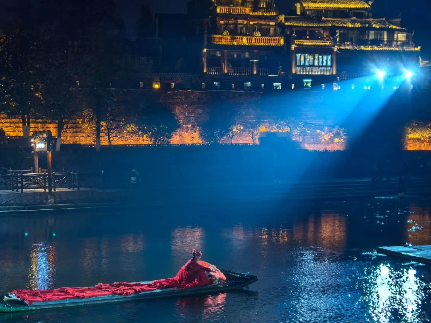 Traditional performance on a boat in Fenghuang Ancient Town at night