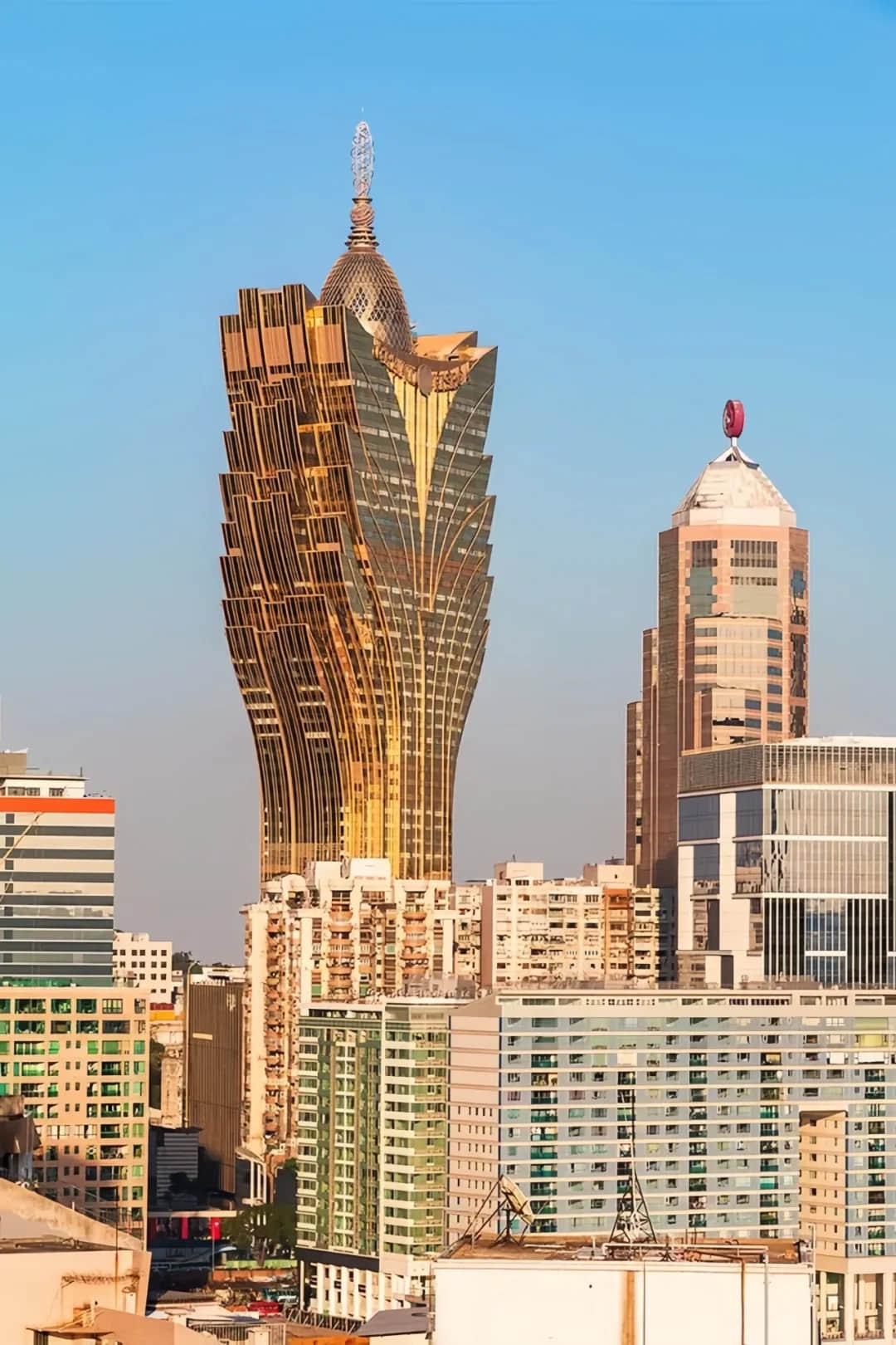 Grand Lisboa Hotel during daytime among other buildings