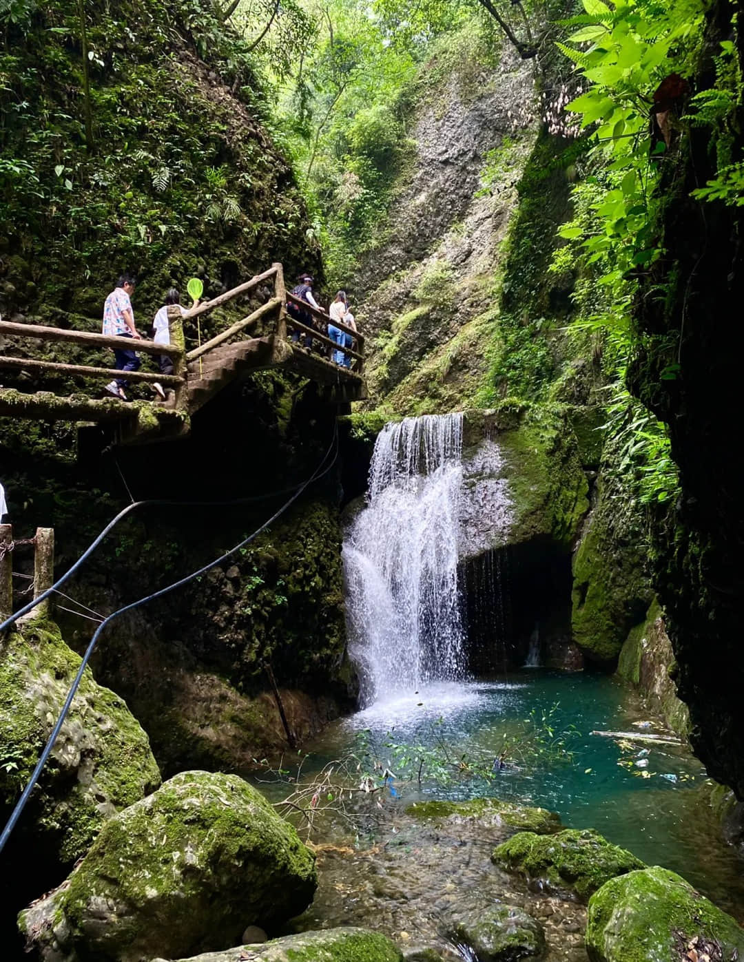 Mountain hiking trail with waterfall views