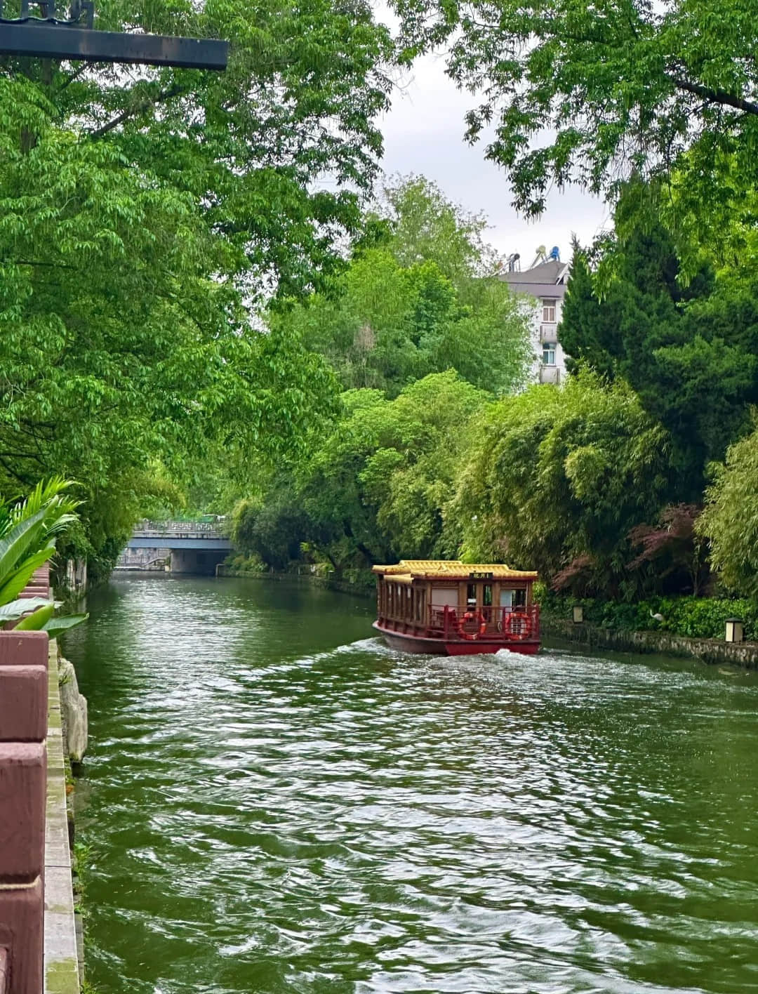 Qinhuai River during daytime with traditional boats