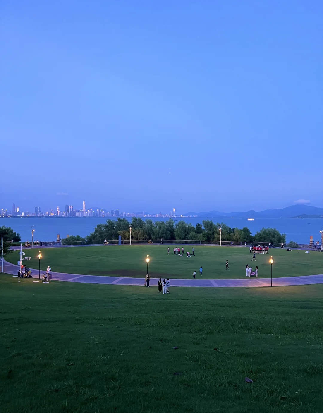 Shenzhen Bay Park at night with illuminated lawn and waterfront