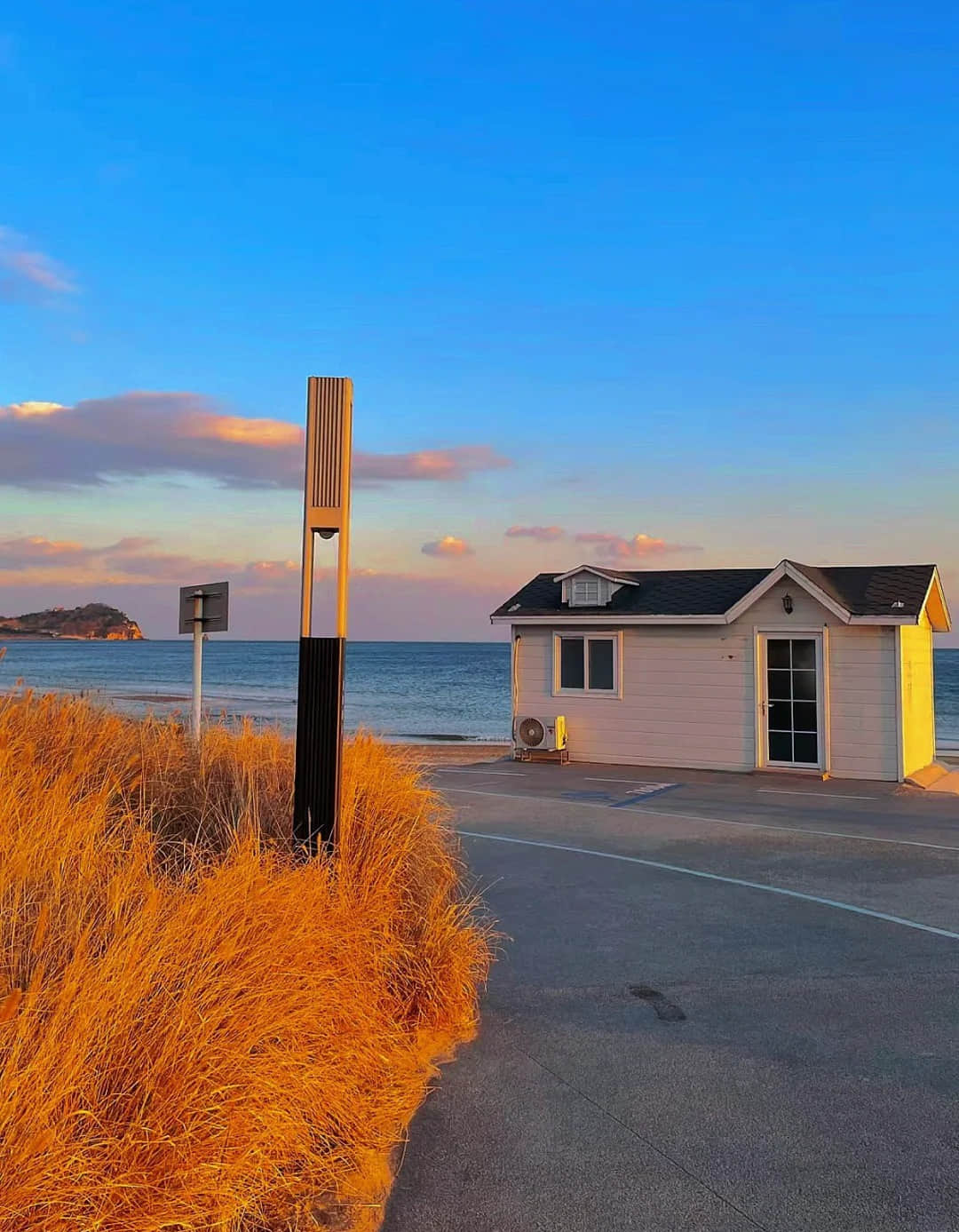 Sunset and houses at Shilaoren Beach