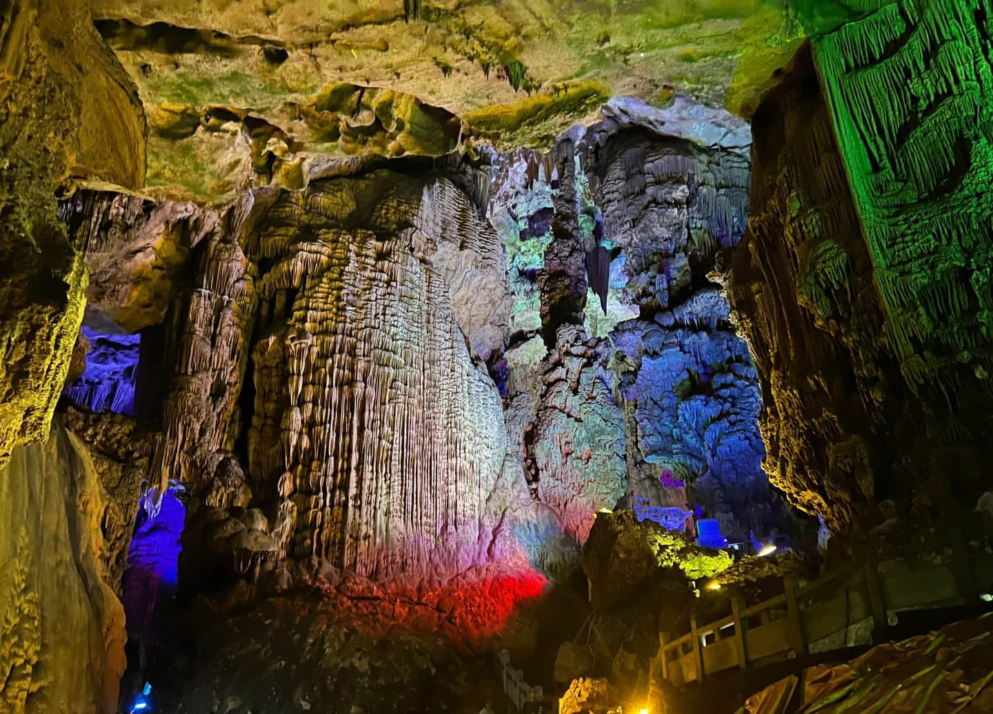 Colorfully lit cave formations showcasing red and blue lighting effects