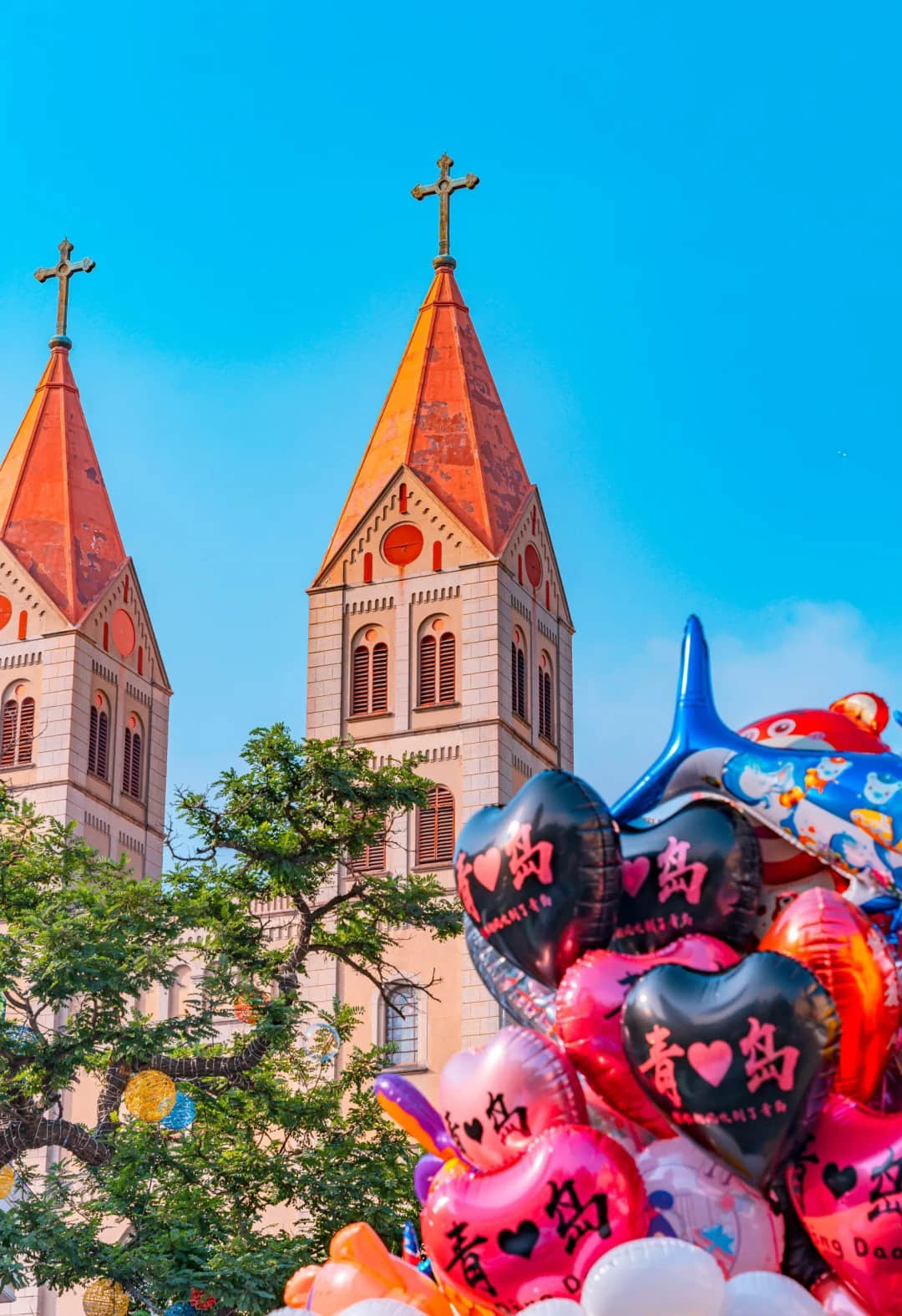 Side view of St. Michael's Cathedral with I Love Qingdao balloon